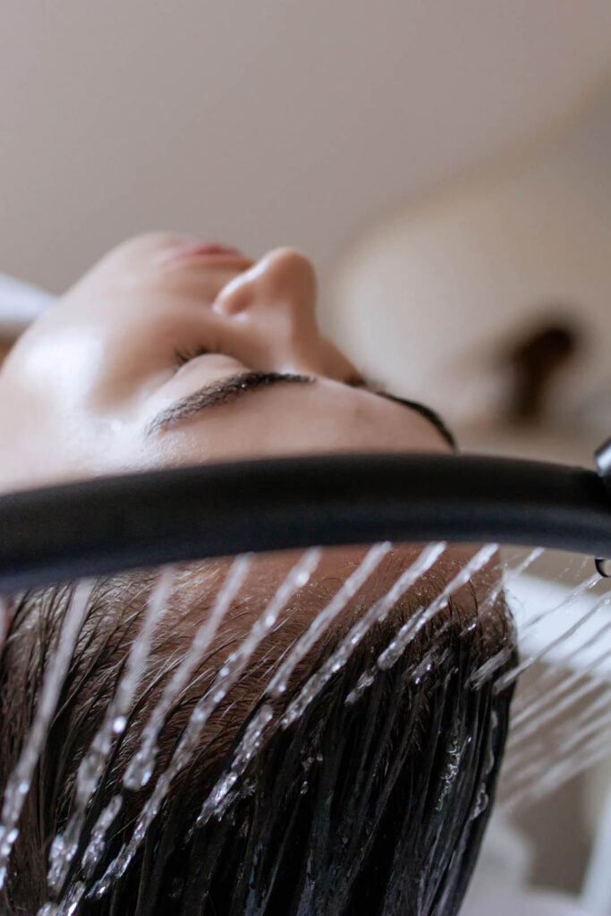 Close-up of a woman receiving a head massage during a Japanese h